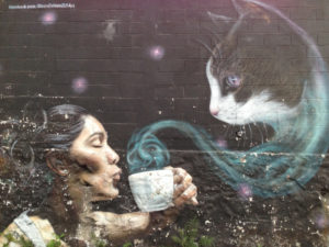 Example of street art: woman and cup o' cat