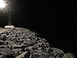 Los Cabos marina breakwater and sea at night